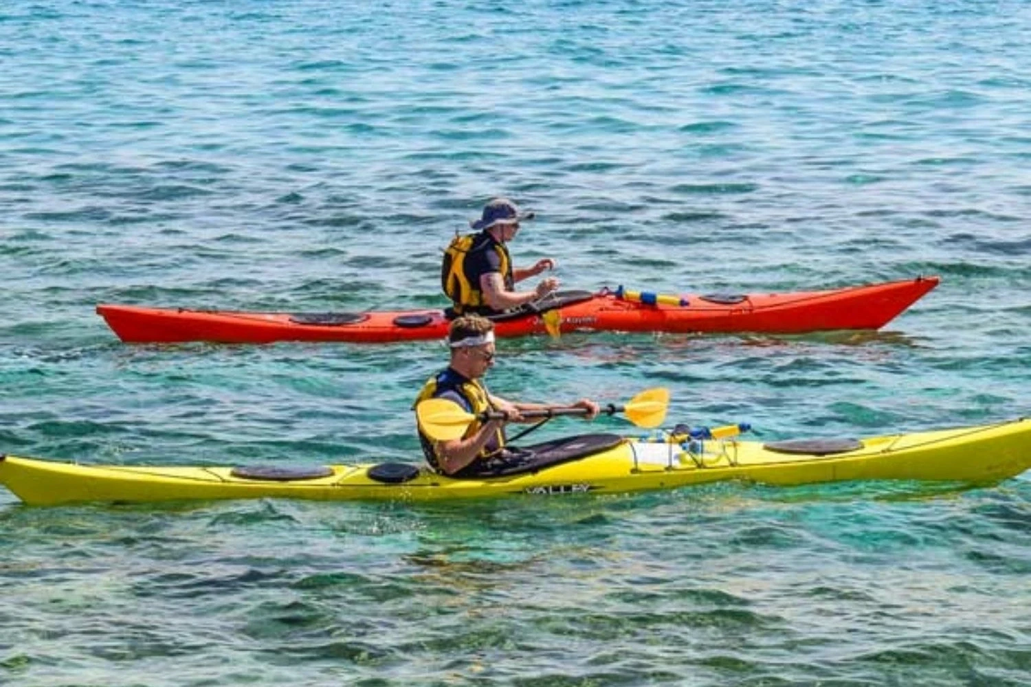 Kayakers paddling turquoise waters