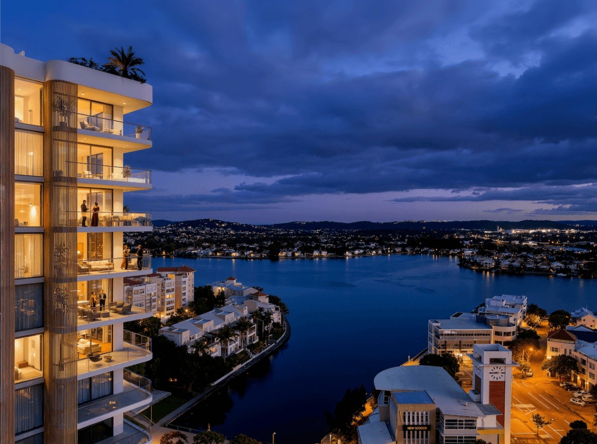 Luxury apartment building at COMO Varsity Lakes overlooking Lake Orr at sunset with Gold Coast skyline views