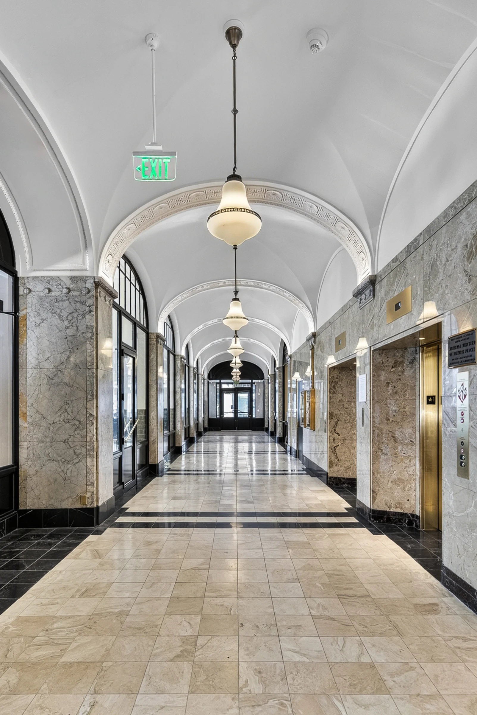 Portrait view of the vaulted corridor at 210 E 6th