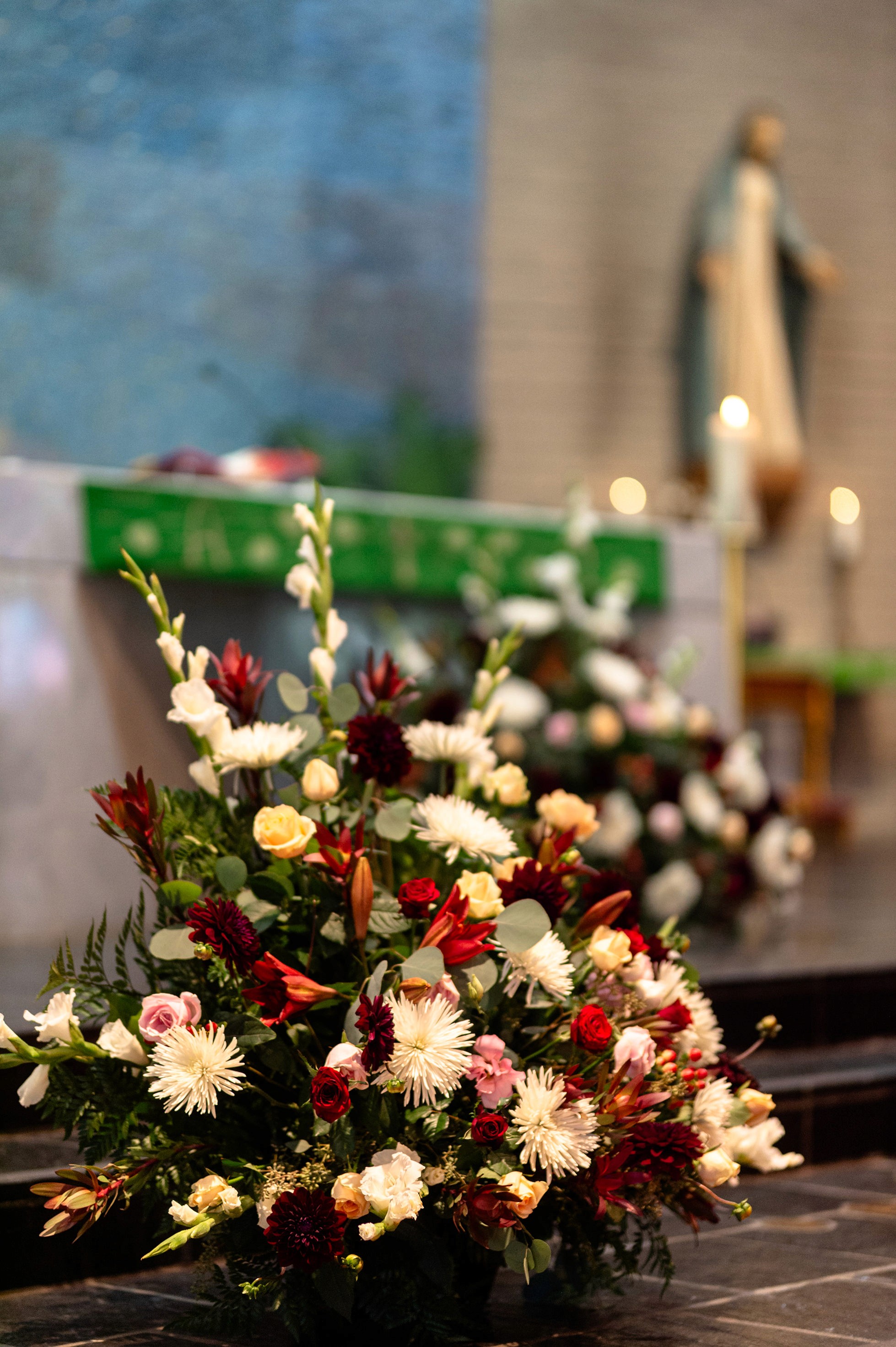 Flat lay wedding details with bouquet, rings, and sparkling bridal heels