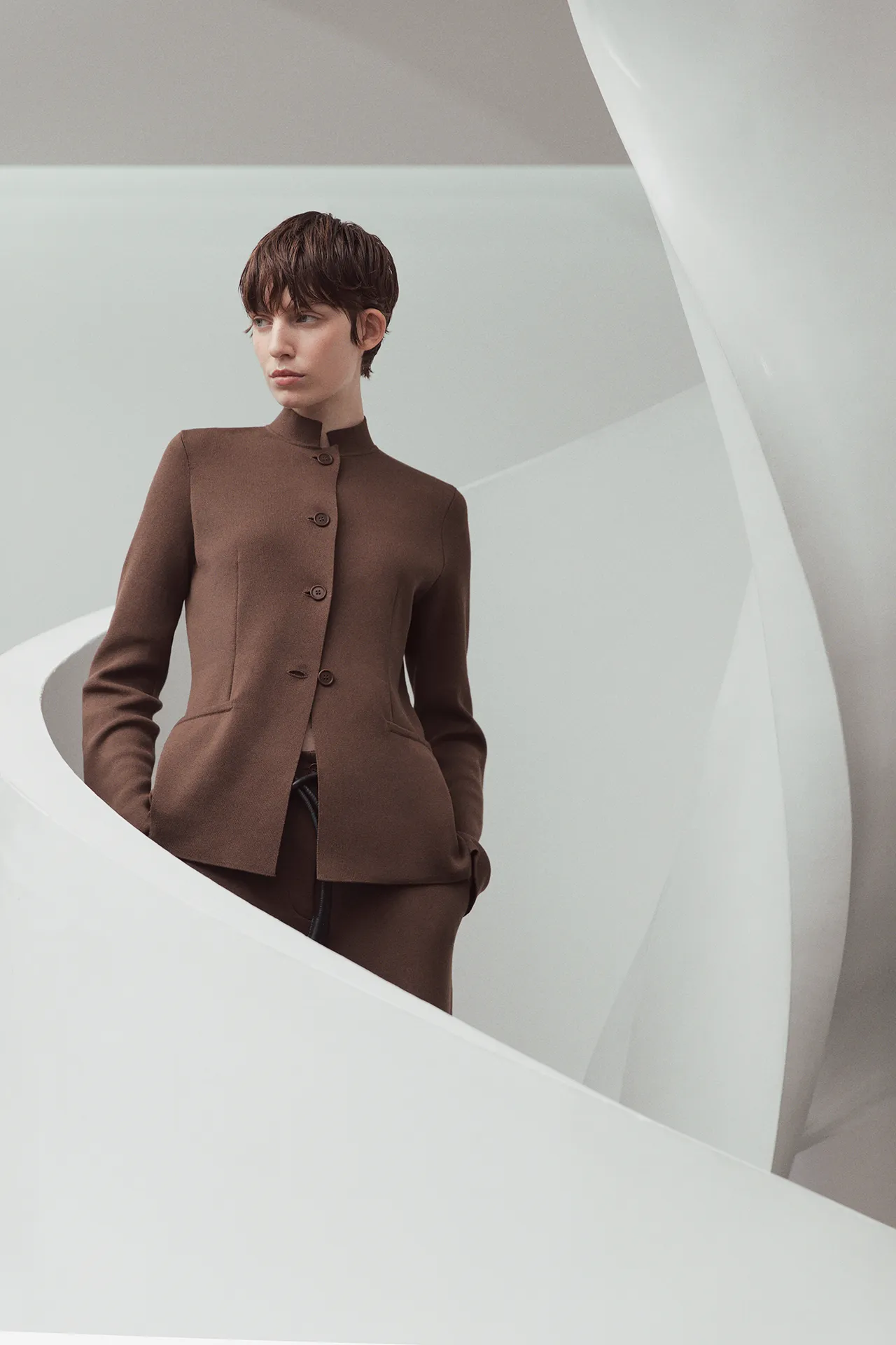 Aida Barni SS26 collection women's brown fine-knit button-up jacket with a stand collar, paired with matching brown trousers.