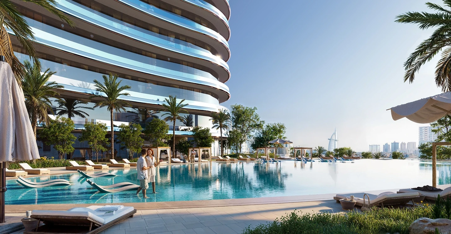 Infinity pool deck at Binghatti Skyflame overlooking Burj Al Arab. Premium property listed by real estate agent.