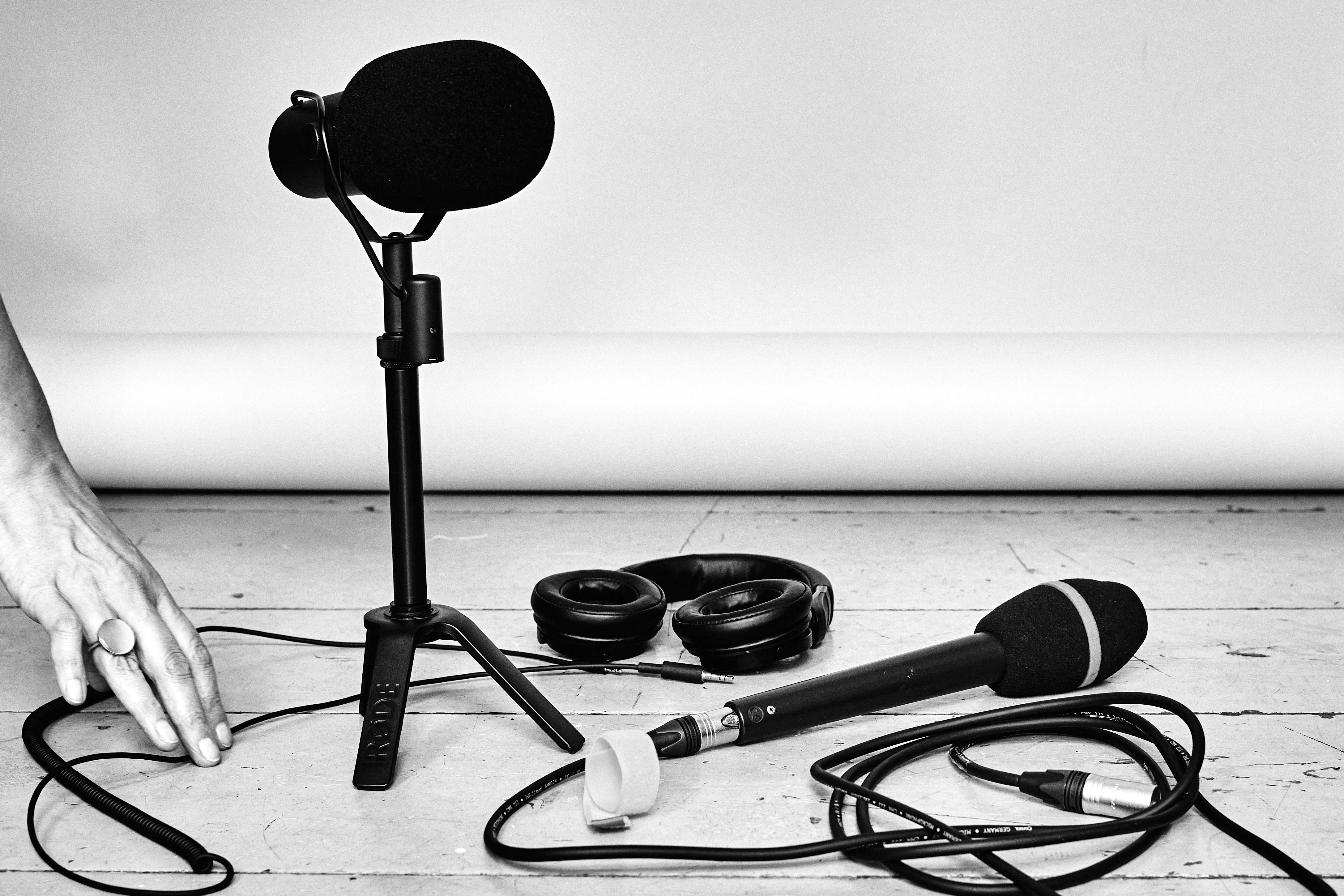 man wearing gray polo shirt beside dry-erase board