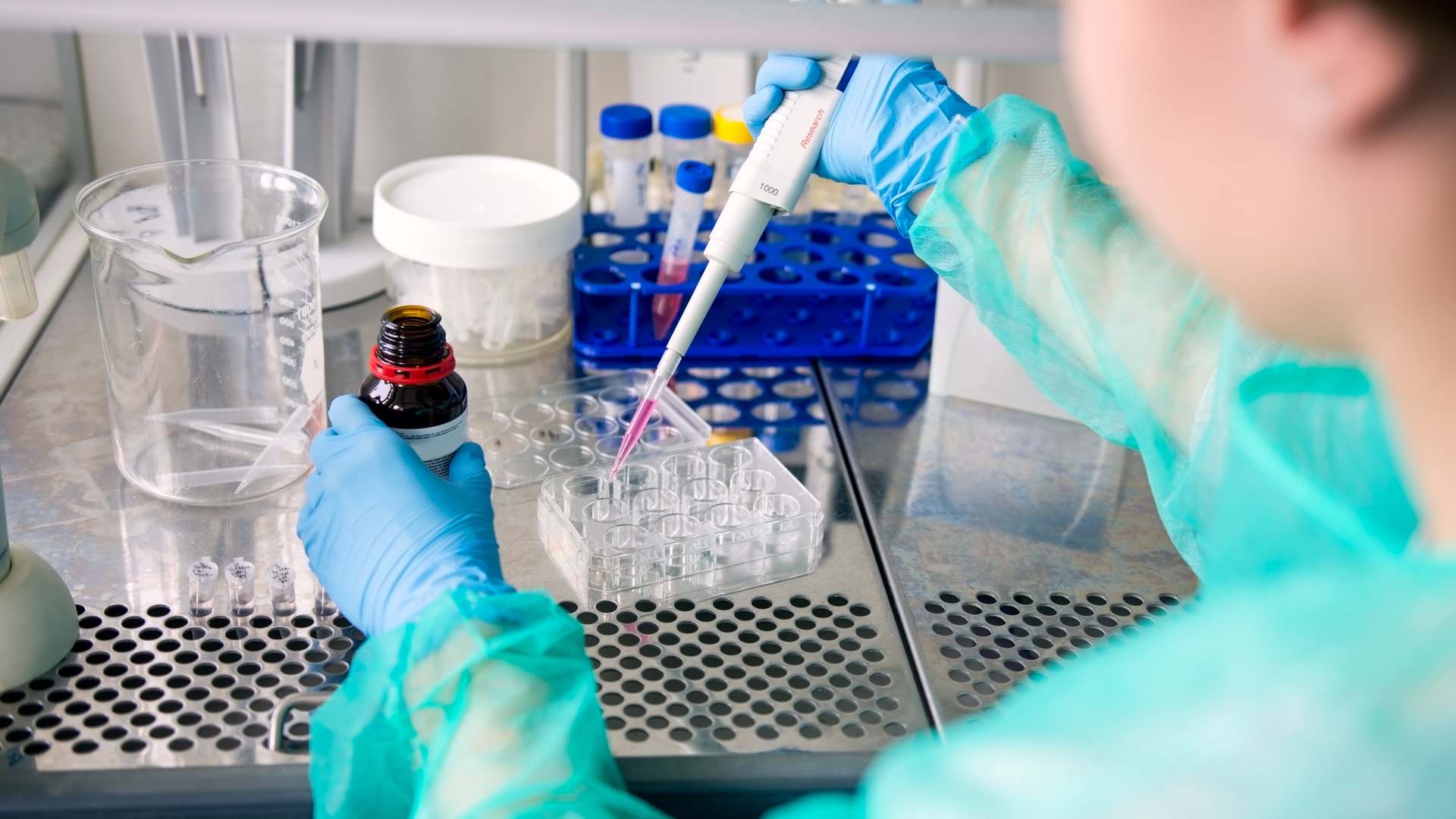 Pipetting in a laboratory.