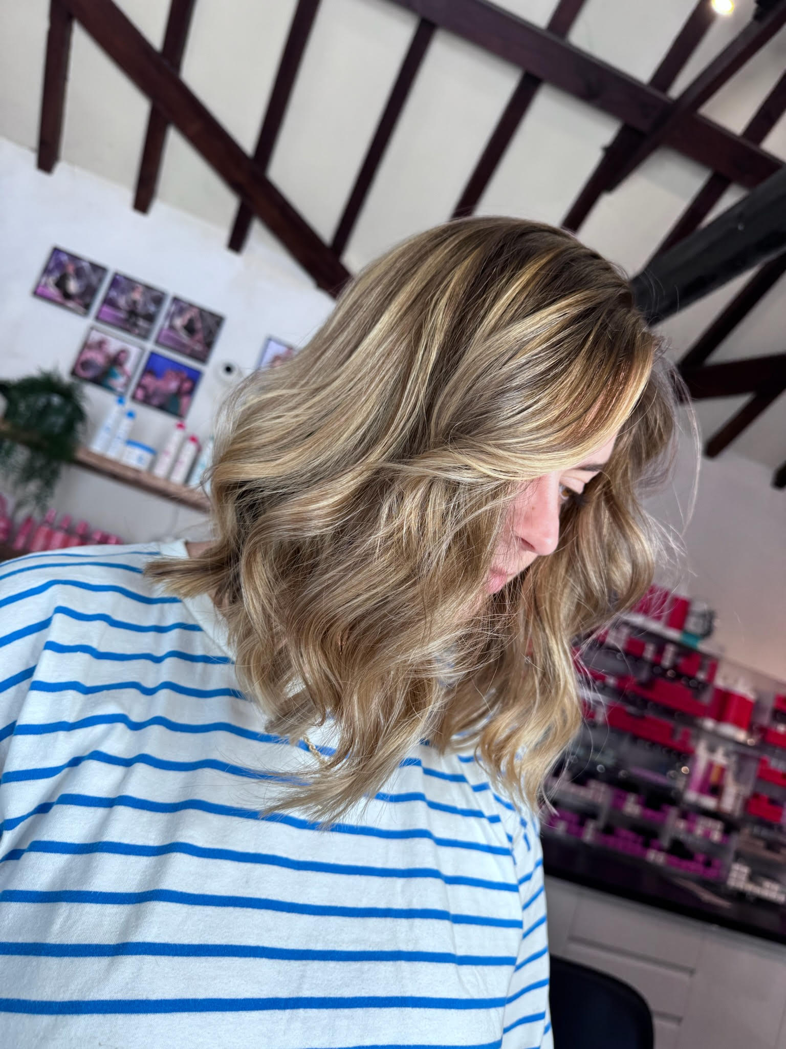 Woman with hair cut to shoulder length and with highlights