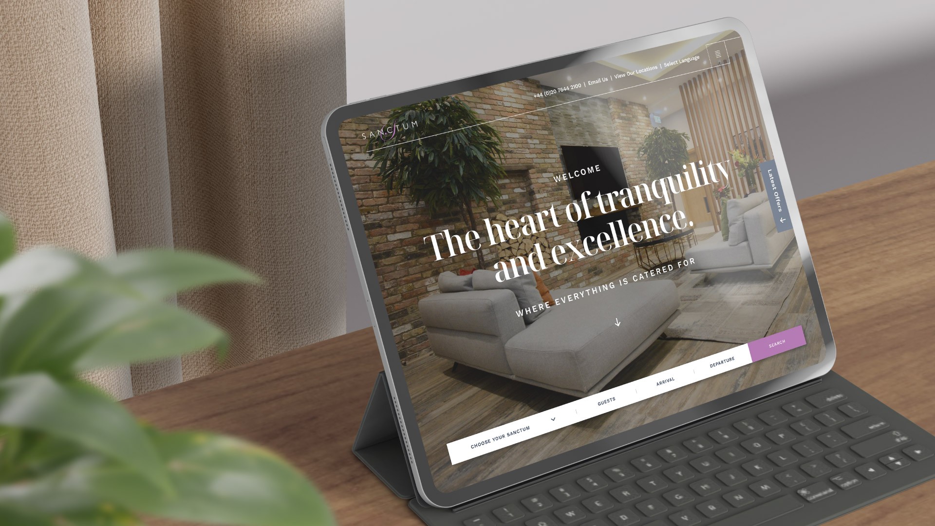 Sanctum London website home page shown on iPad on desk