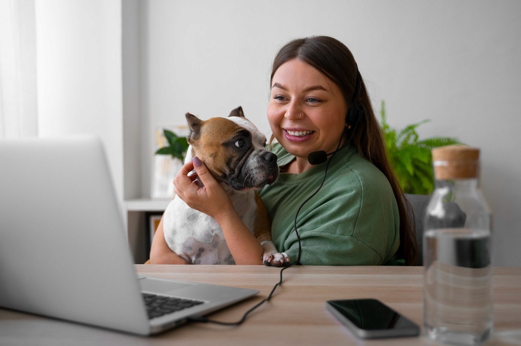 Woman on a video call with a dog