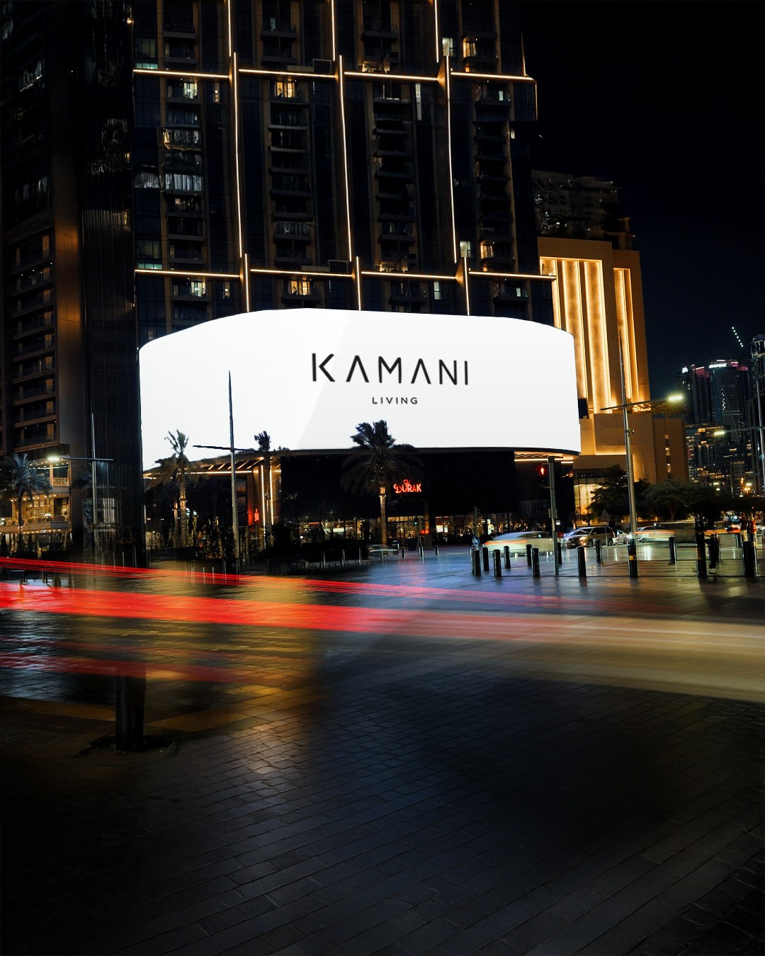 Black-and-white photo of a band rehearsal with guitarist, drummer, and people gathered under string lights.