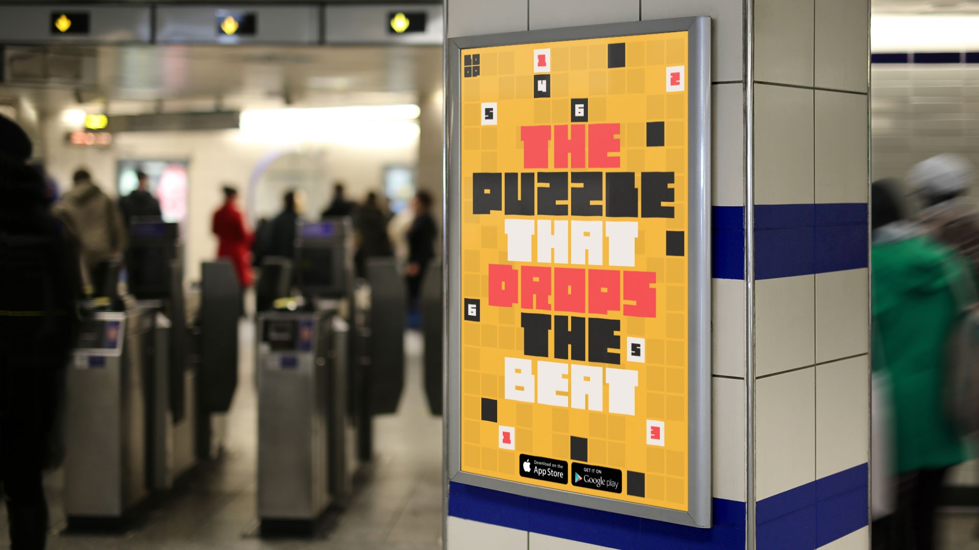 A yellow poster with black, red, and white text reads “THE PUZZLE THAT DROPS THE BEAT” in a stylized font. The poster is mounted on a wall with blue and white tiles. In the background, blurred figures of people stand near automated turnstiles in an indoor setting.
