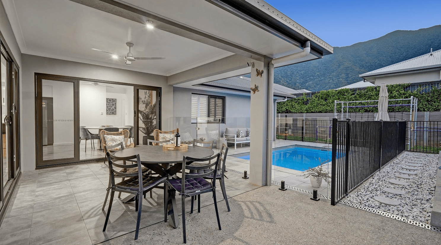 A person in yellow gloves and blue gloves cleaning a floor