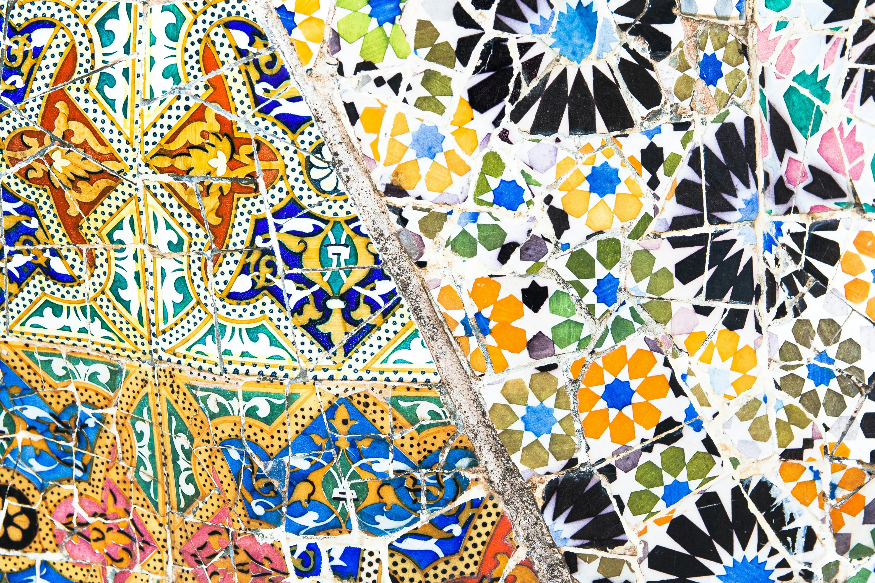 A closeup of ornate and colorful tiles at Park Guell.