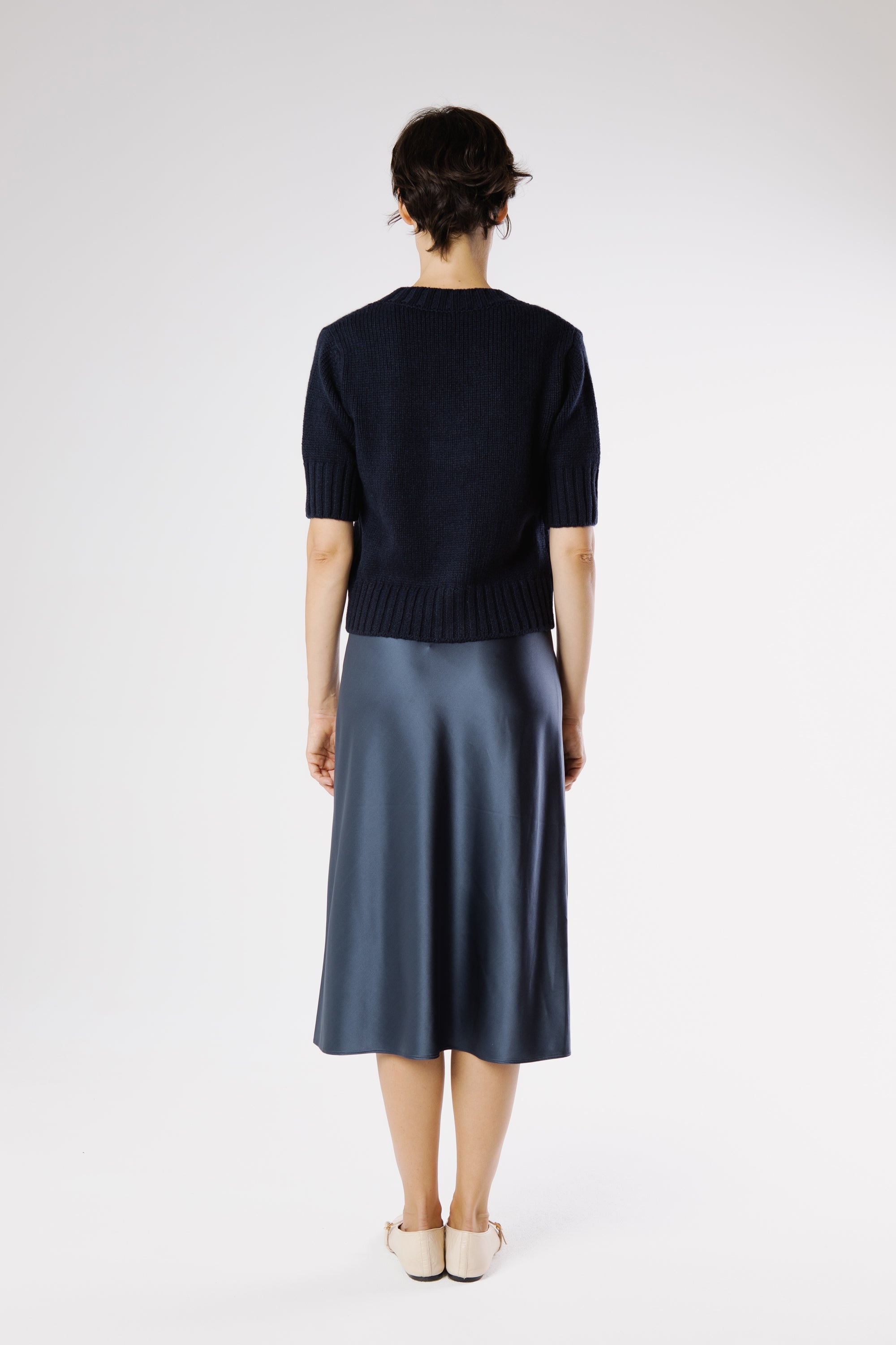 Back view of Artemisa Cashmere Cardigan Beluga showing clean silhouette and fine Italian cashmere knit structure.