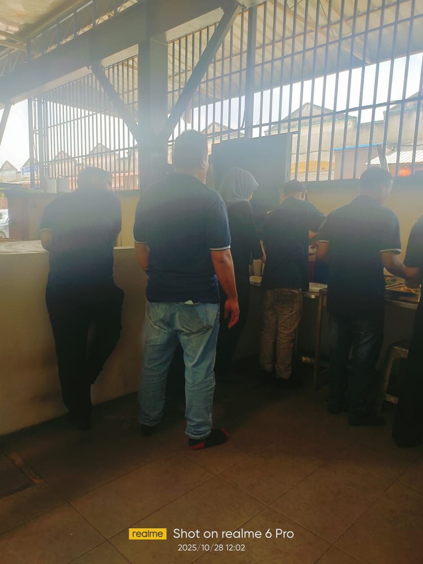 Autofill employees queuing for lunch during the new baby celebration.