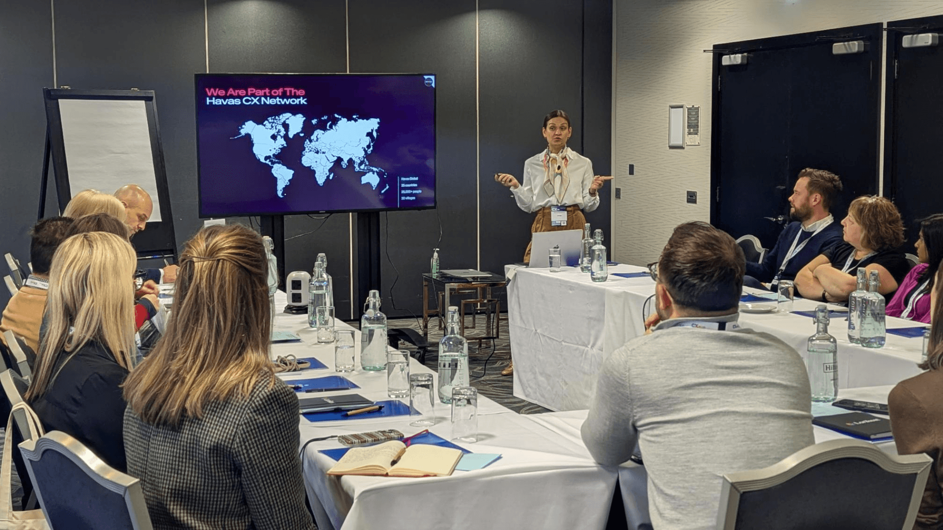 Rachael Brandon-Lai speaks infront of a roomfull of attentive people