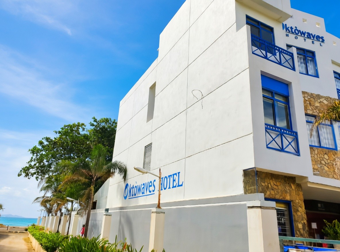 White modern building exterior with blue window accents at Oktowaves Hotel Nasugbu