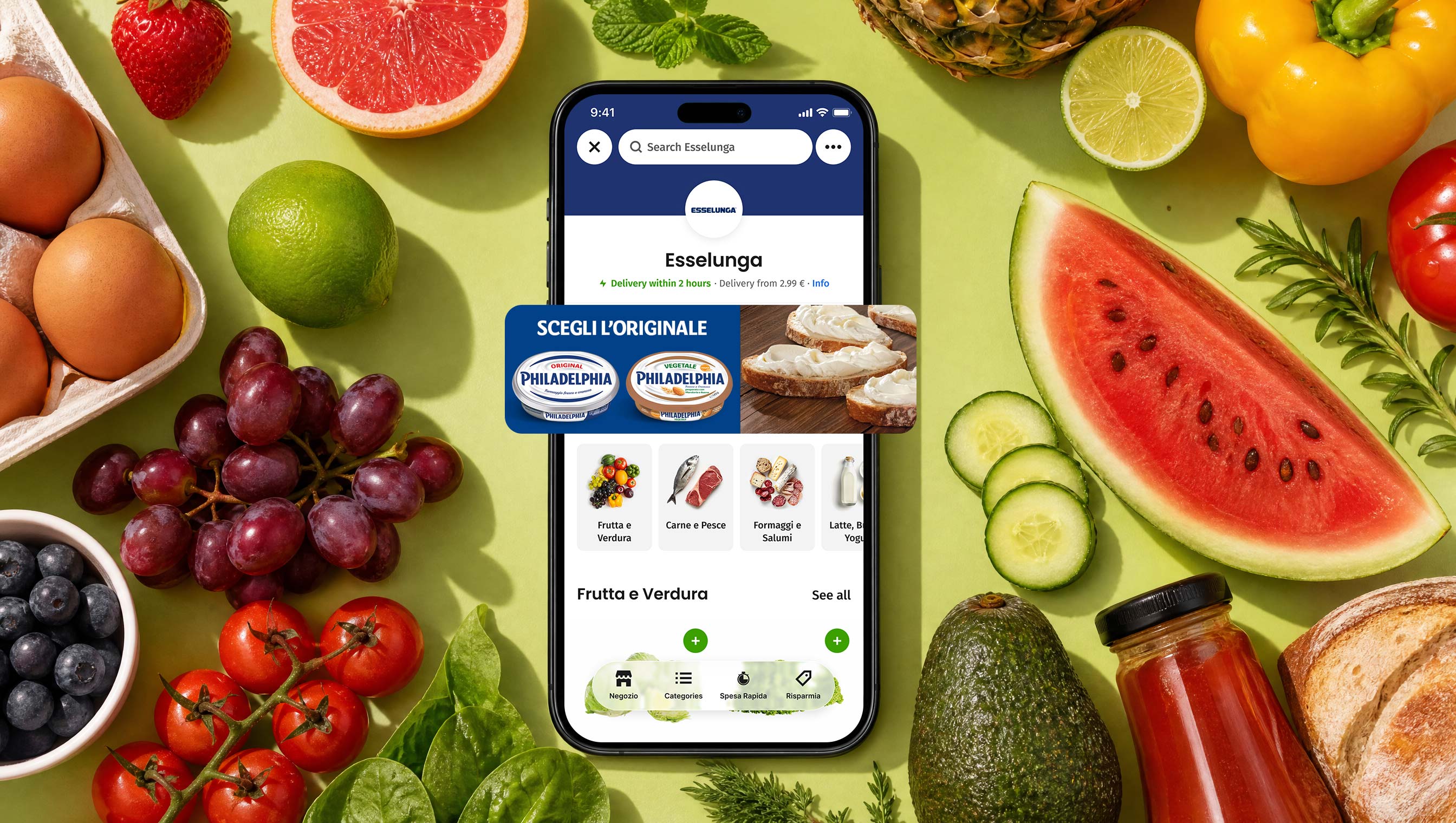 Everli app showing an Esselunga store with a sponsored Philadelphia placement, on a table of fresh produce