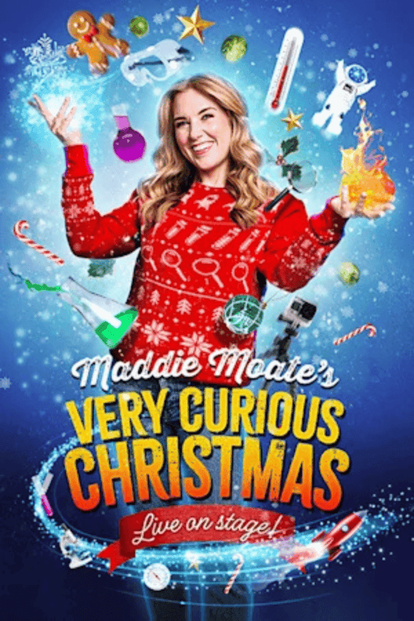 Performer in festive sweater surrounded by Christmas and science-themed items for Maddie's Curious Christmas.
