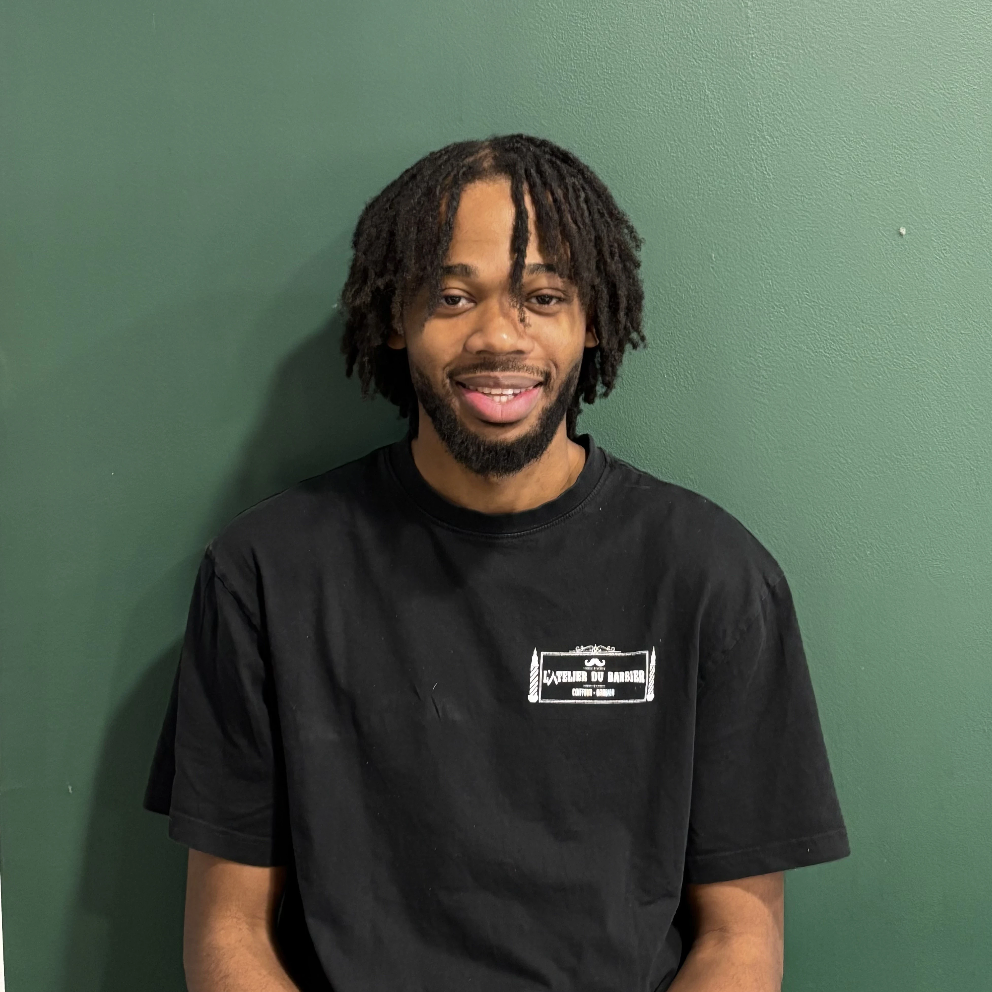 person wearing blue top smiling