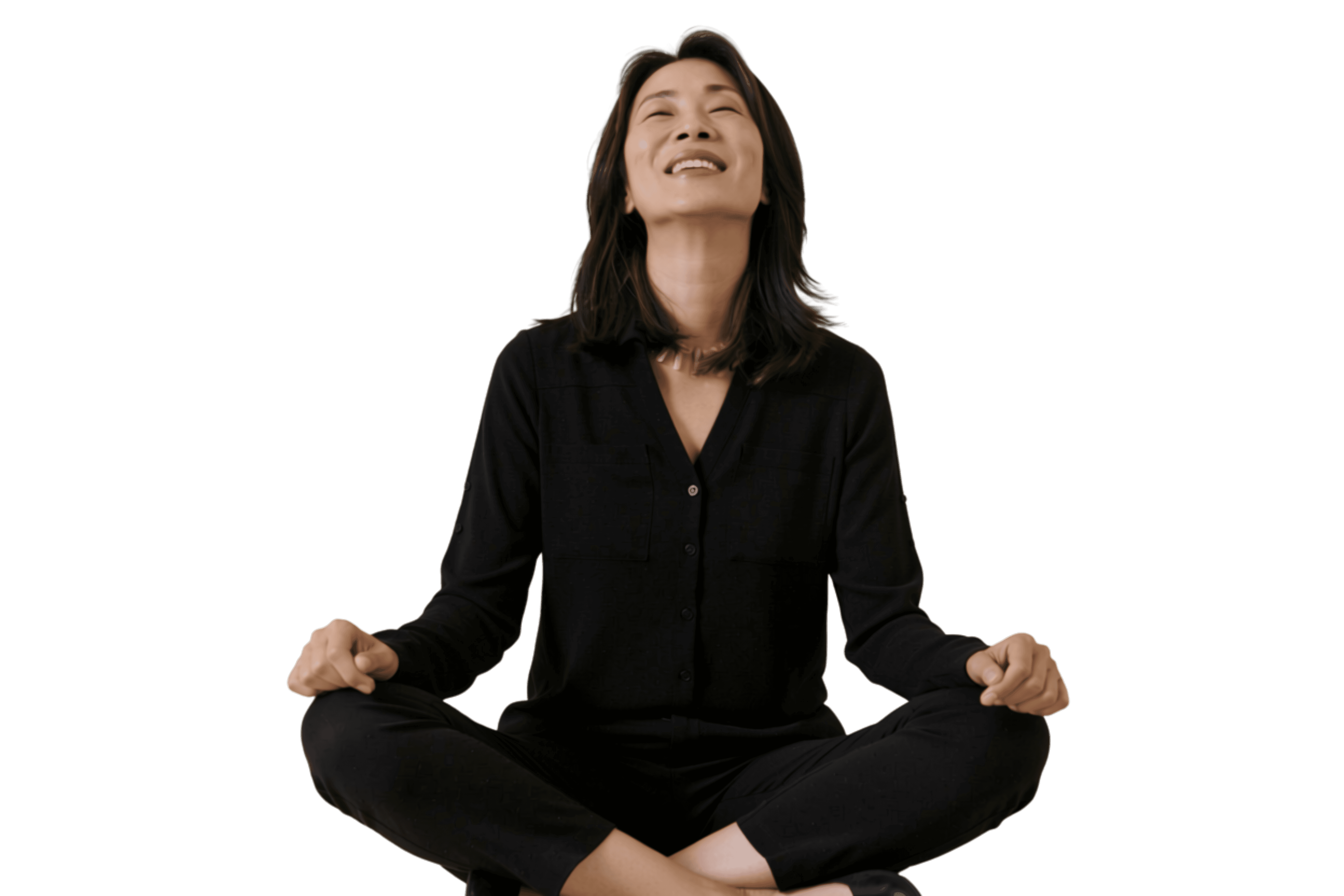 A woman sits cross-legged with eyes closed, wearing a white blouse and a long purple skirt, looking serene.