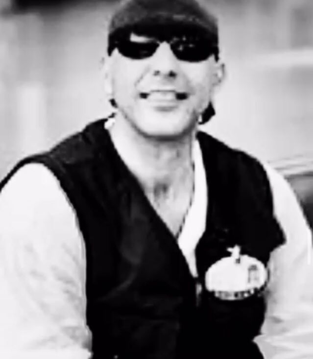 man in black nike jacket wearing white cap