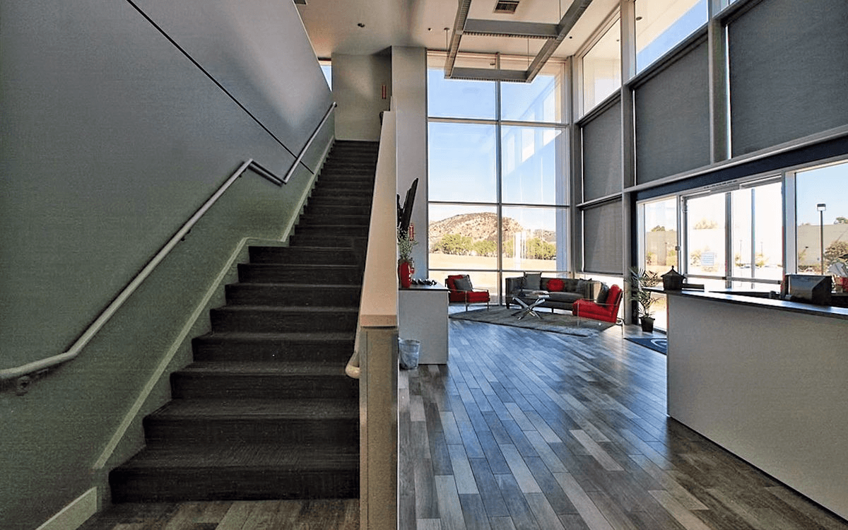 Office entry with a staircase leading up to the office spaces above.