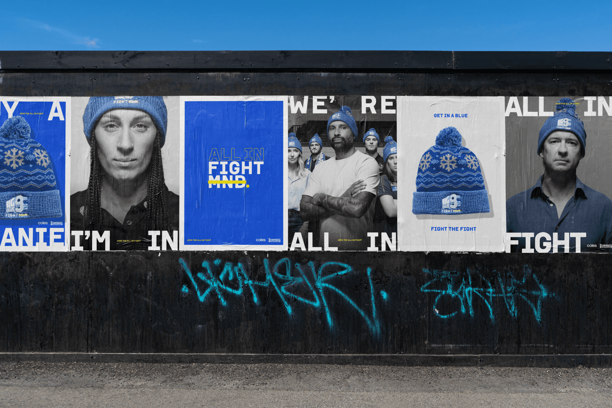 Streetside billboard with flyposters of the Batch.Works brand and illustrations
