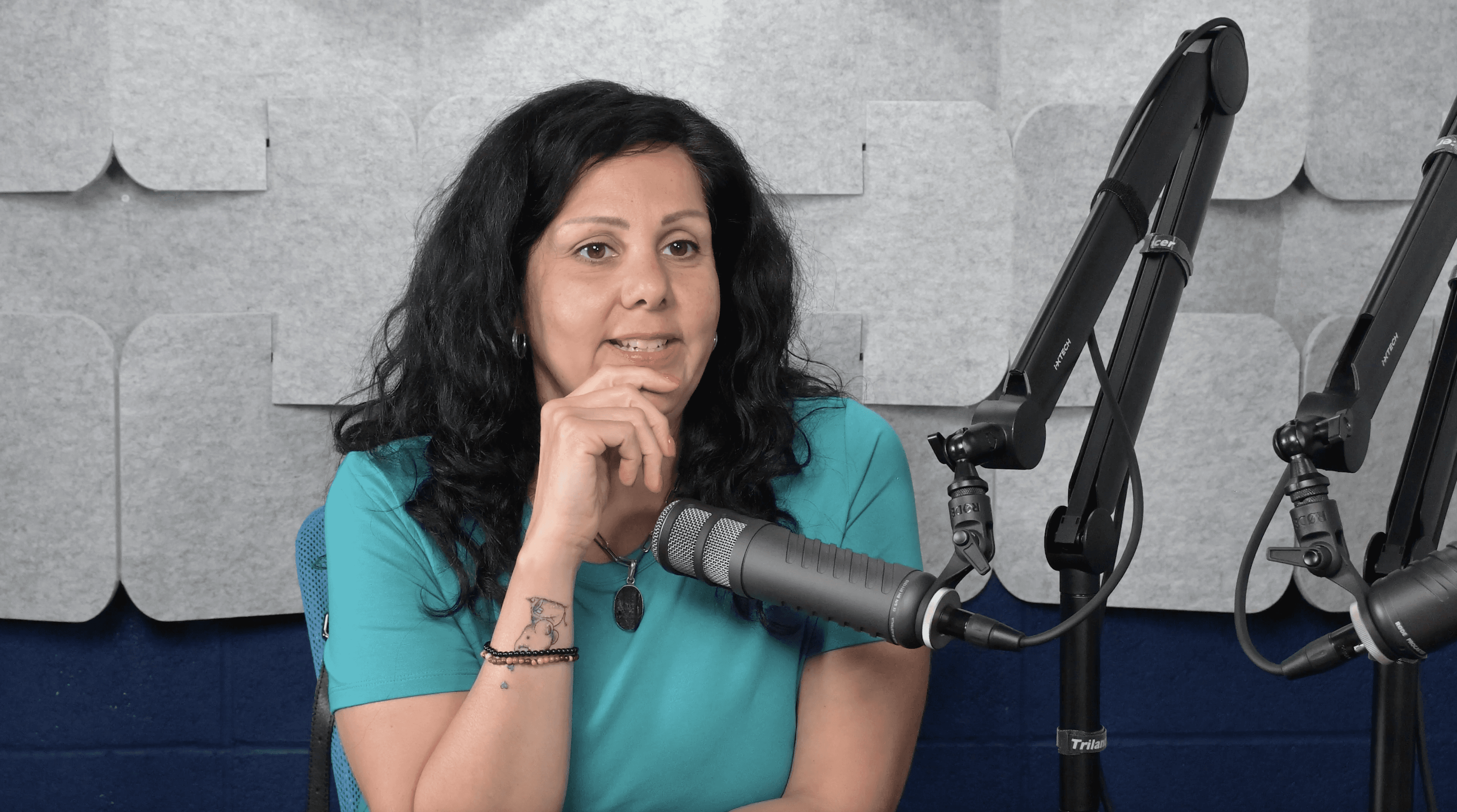 a woman filming a podcast