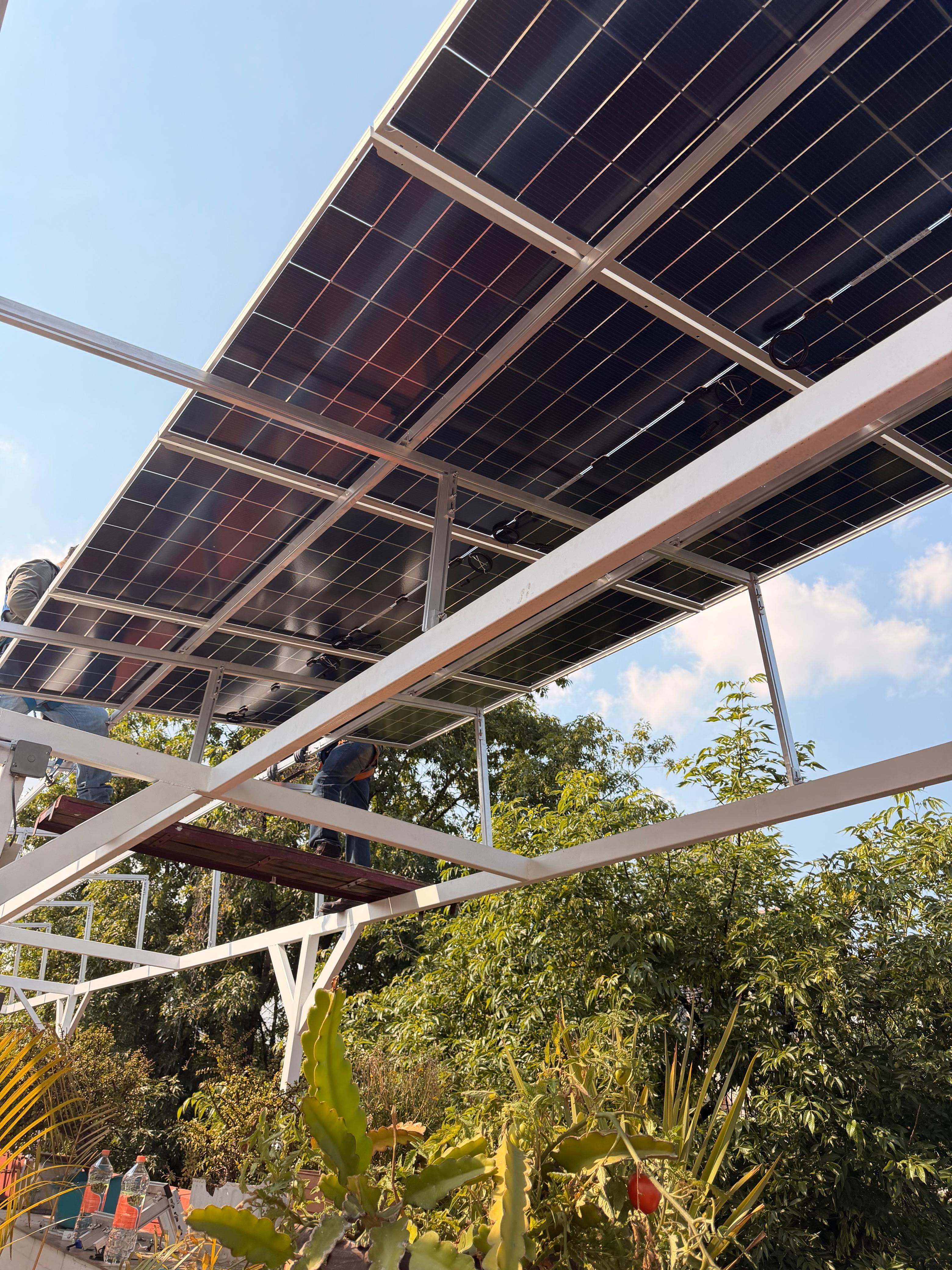two people looking at a tablet and smiling