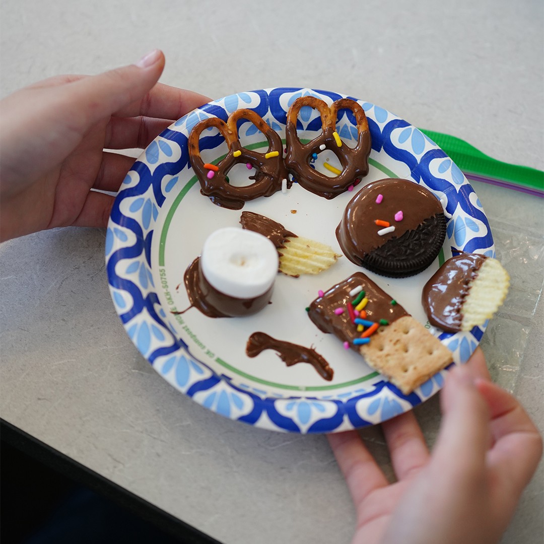 Students learning basic cooking skills during hands-on after school culinary enrichment program