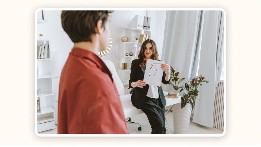 Woman holding “five” note