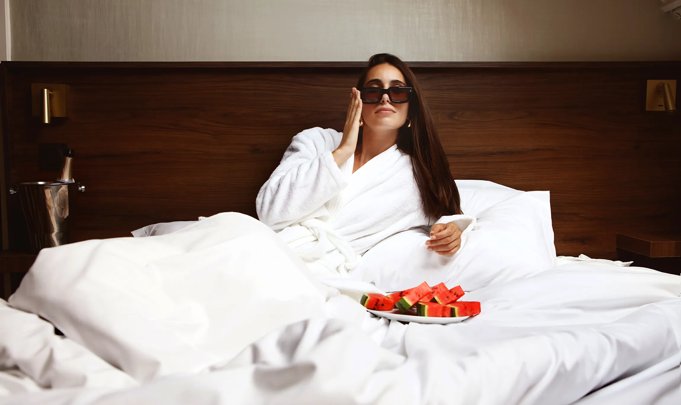 Stack of modern books and magazine with minimalist cover design on leather chair
