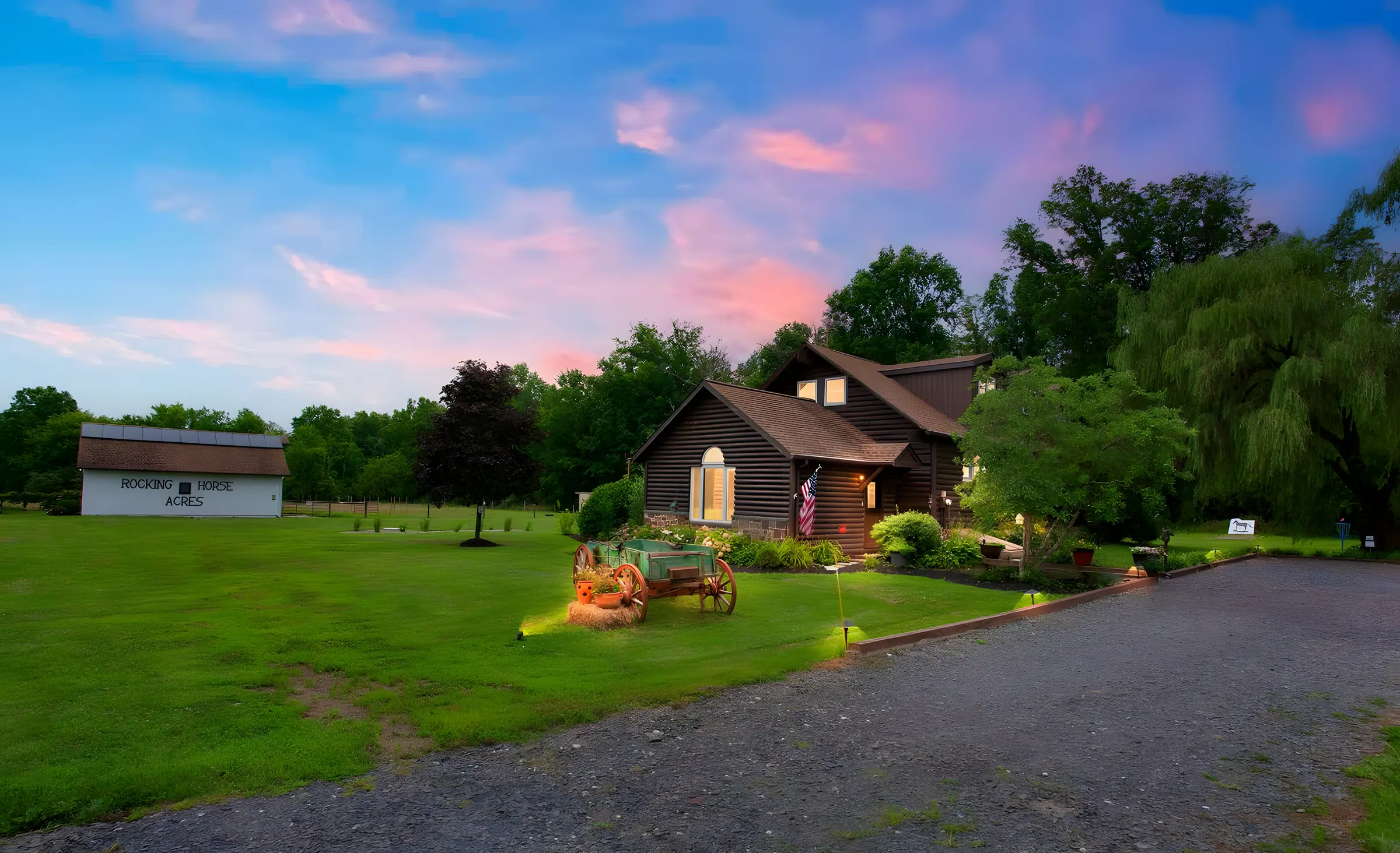 Farmhouse and barn beyond a long gravel drive at sunset, Rocking Horse Acres, Bucks County, PA