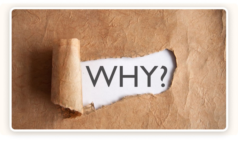 Torn paper revealing the word “WHY?”