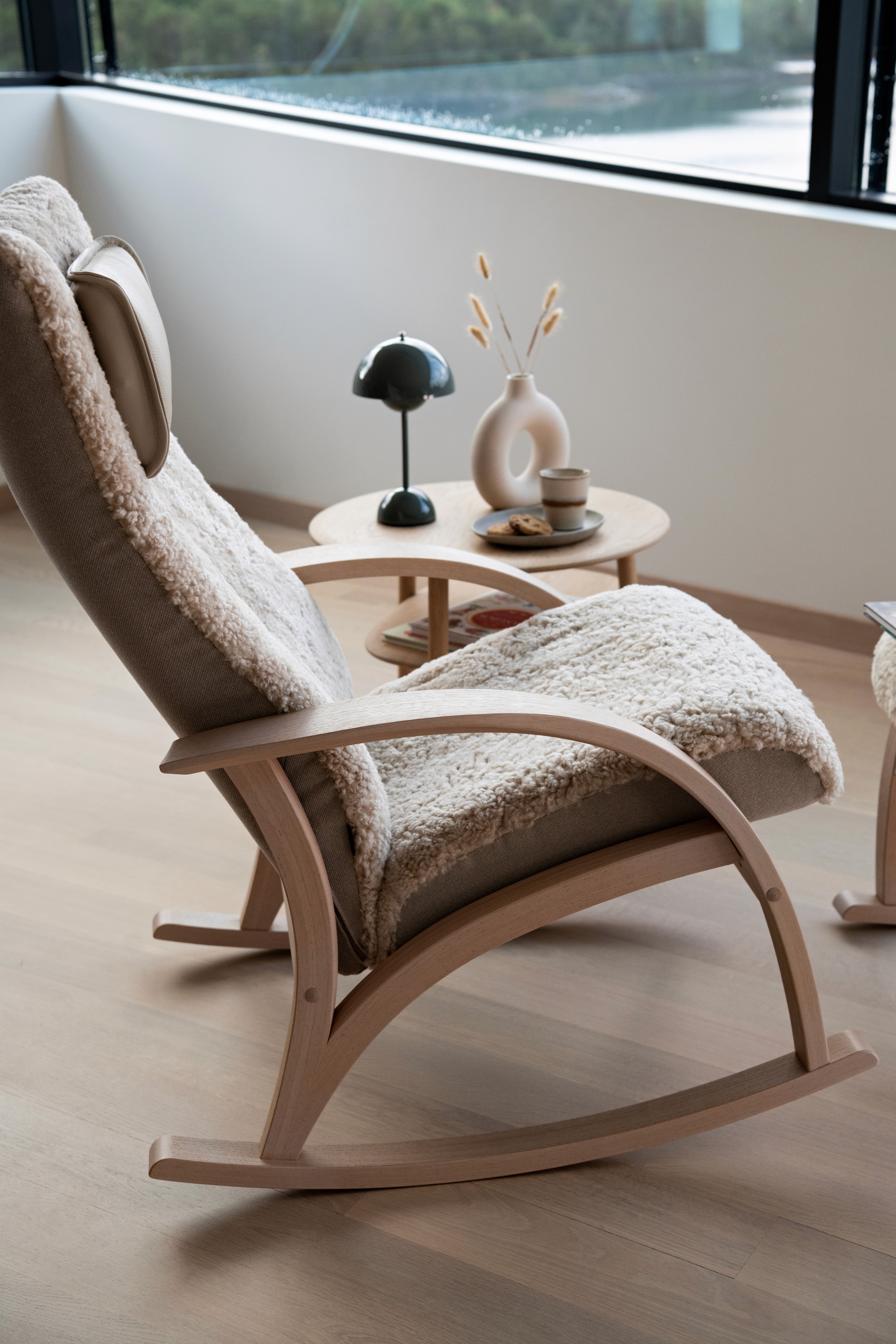 A moody scene of a room with a lamp shade