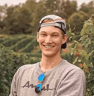 smiling woman wearing blue necklace