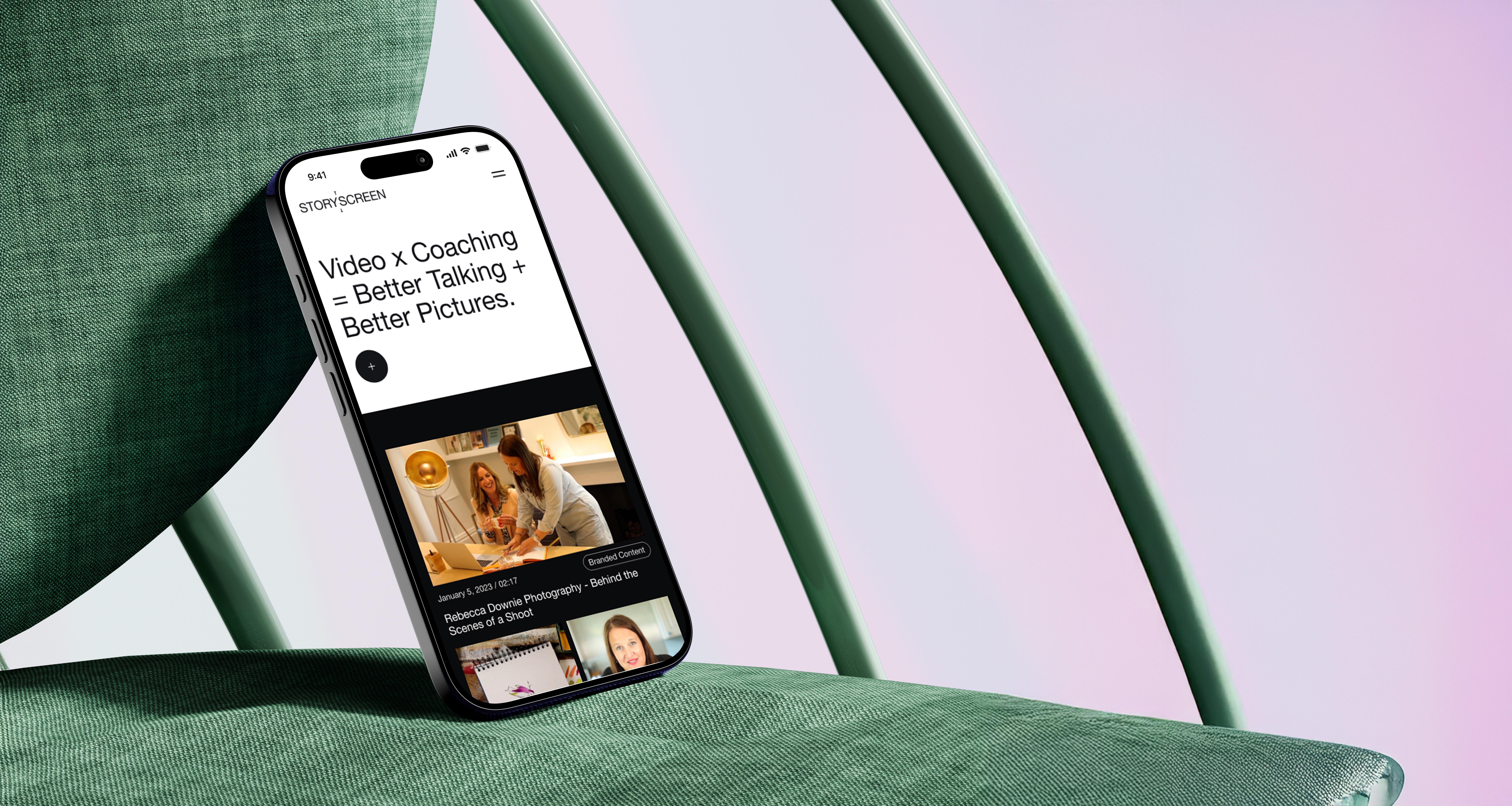 Modern home office setup with a monitor, ergonomic chair, keyboard, and indoor plants near a window with blinds.