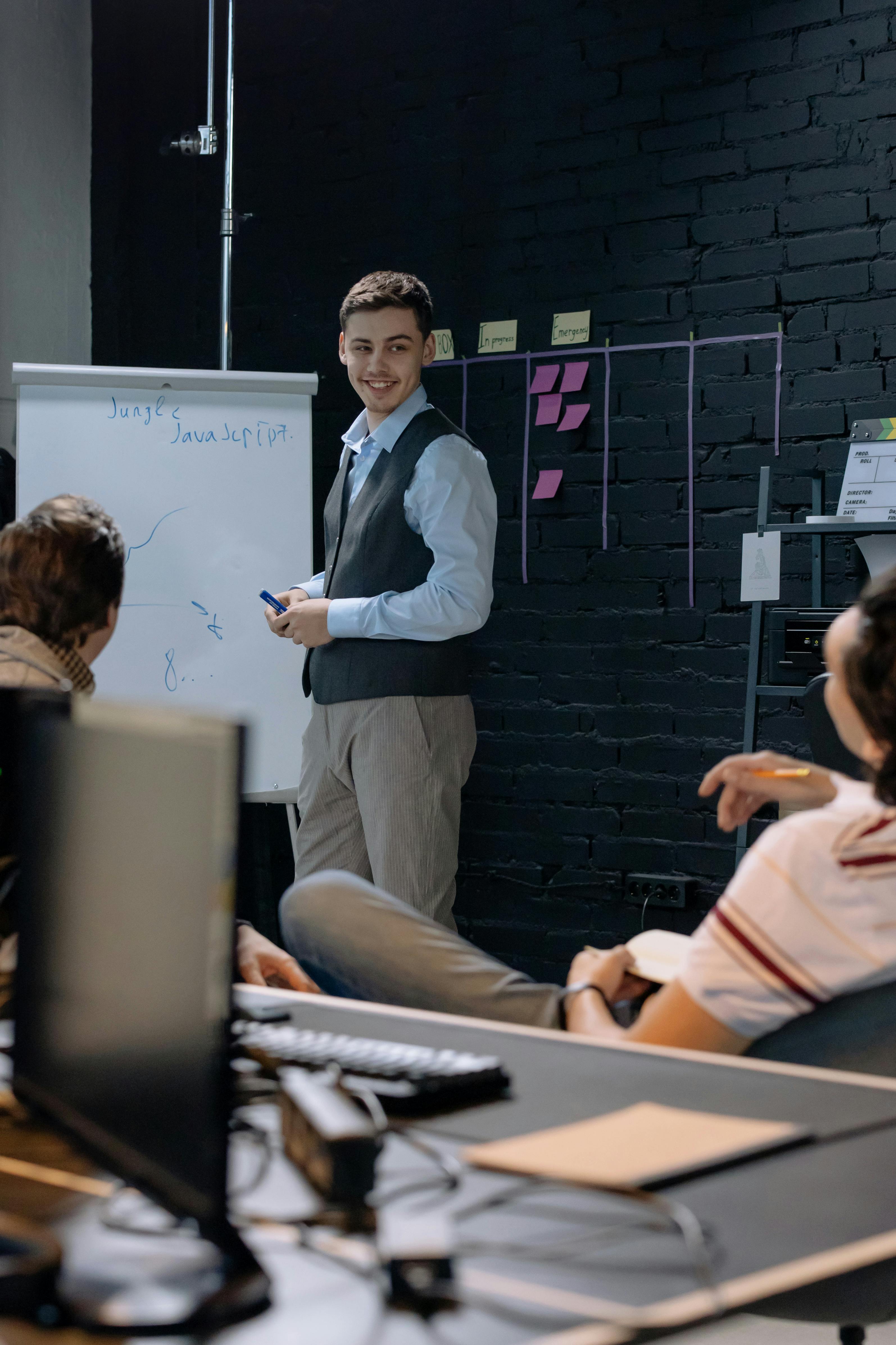 young-professionals-discussing-work-in-an-office-space-while-using-a-whiteboard- - cottonbro-studio (pexels)