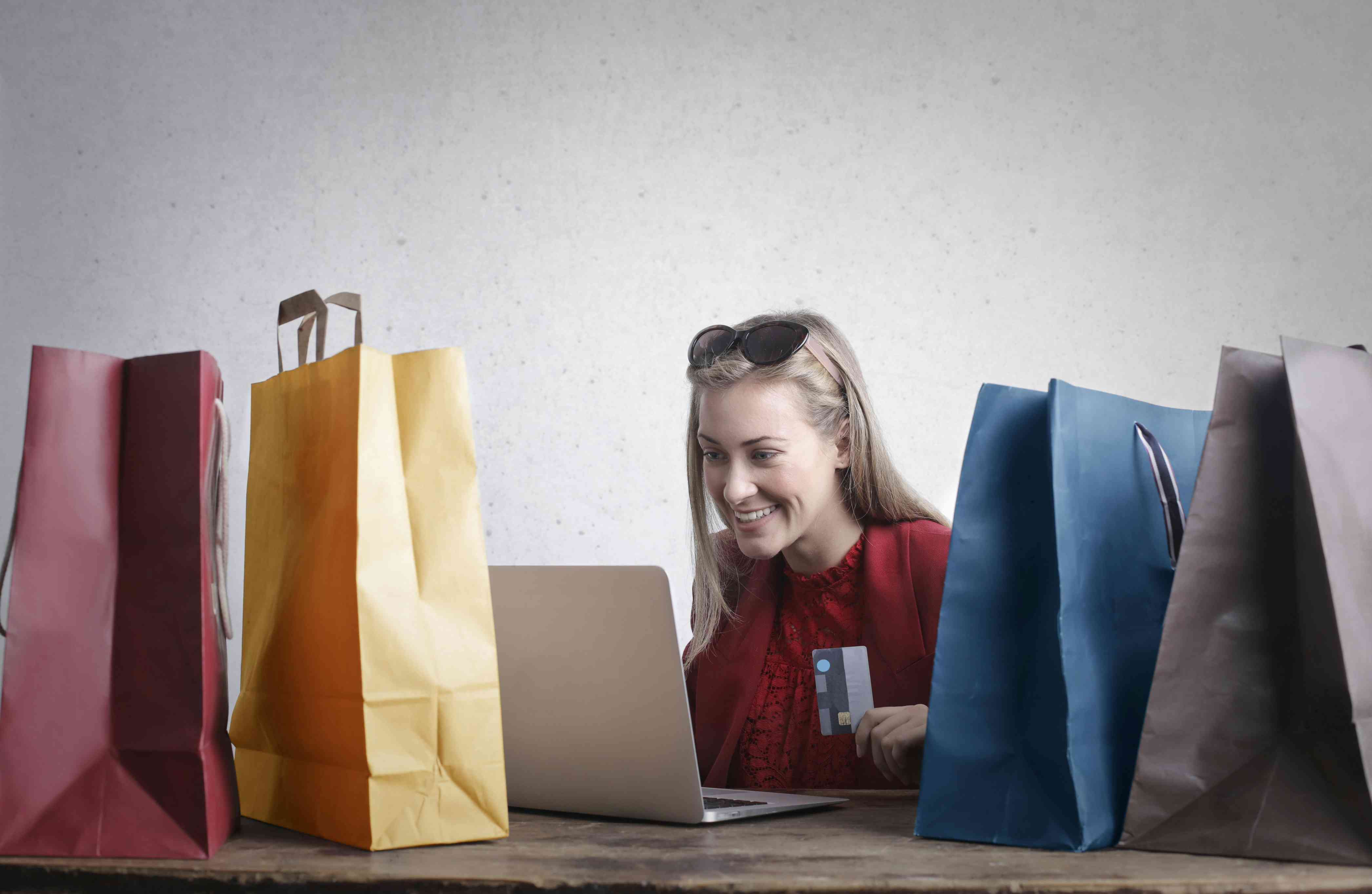 woman making purchases online using her card