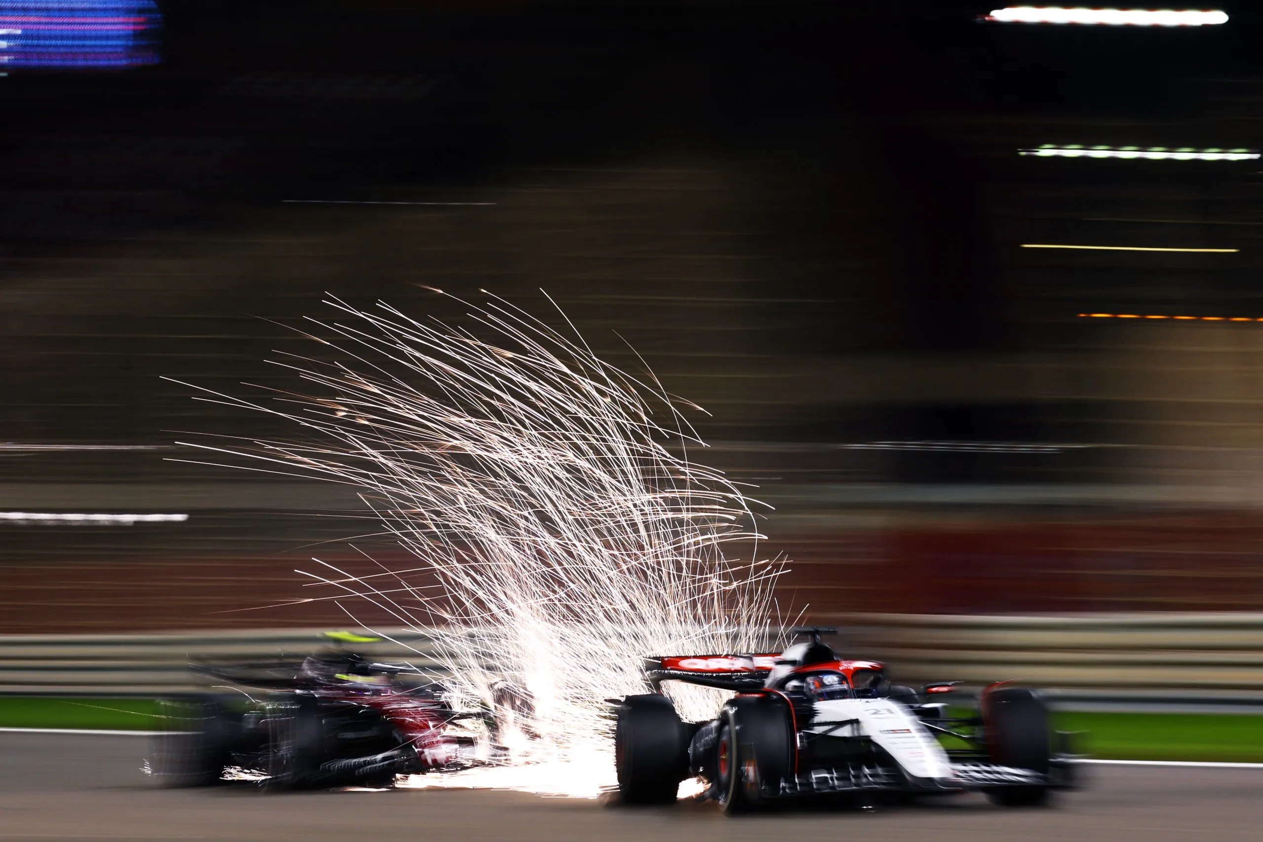why do f1 cars spark, f1 car sparks explained, formula 1 sparks under car, why f1 cars spark at night, f1 skid blocks sparks, titanium skid blocks f1, f1 ground effect sparks, f1 plank and skid blocks, f1 ride height sparks, do f1 sparks mean damage, are f1 sparks dangerous, f1 night race sparks, singapore f1 sparks, f1 bottoming out sparks, fia skid block rules, how f1 aerodynamics work, f1 ground effect explained, modern f1 cars sparks, 2022 f1 ground effect sparks, formula 1 technical explained