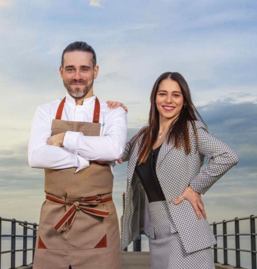 woman in black long sleeve shirt sitting on white couch