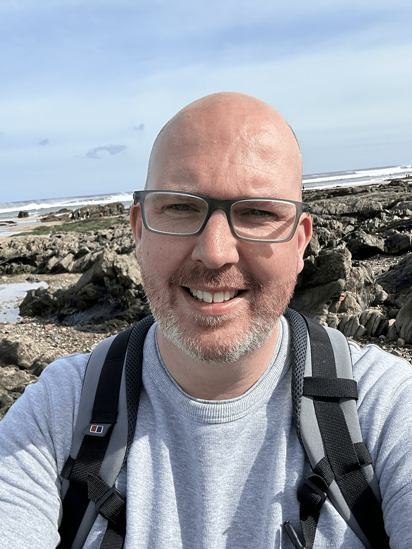 Mark walking by the sea