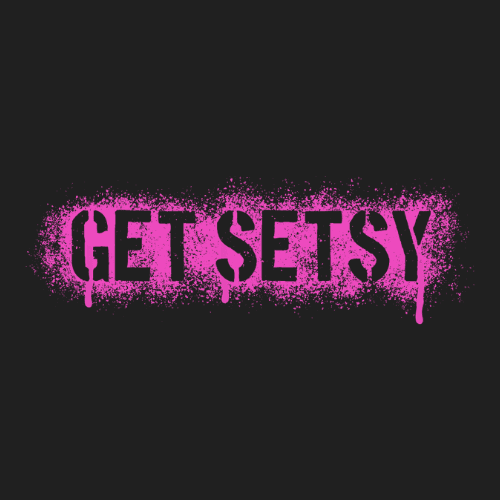 Man and two girls taking a selfie in a tent