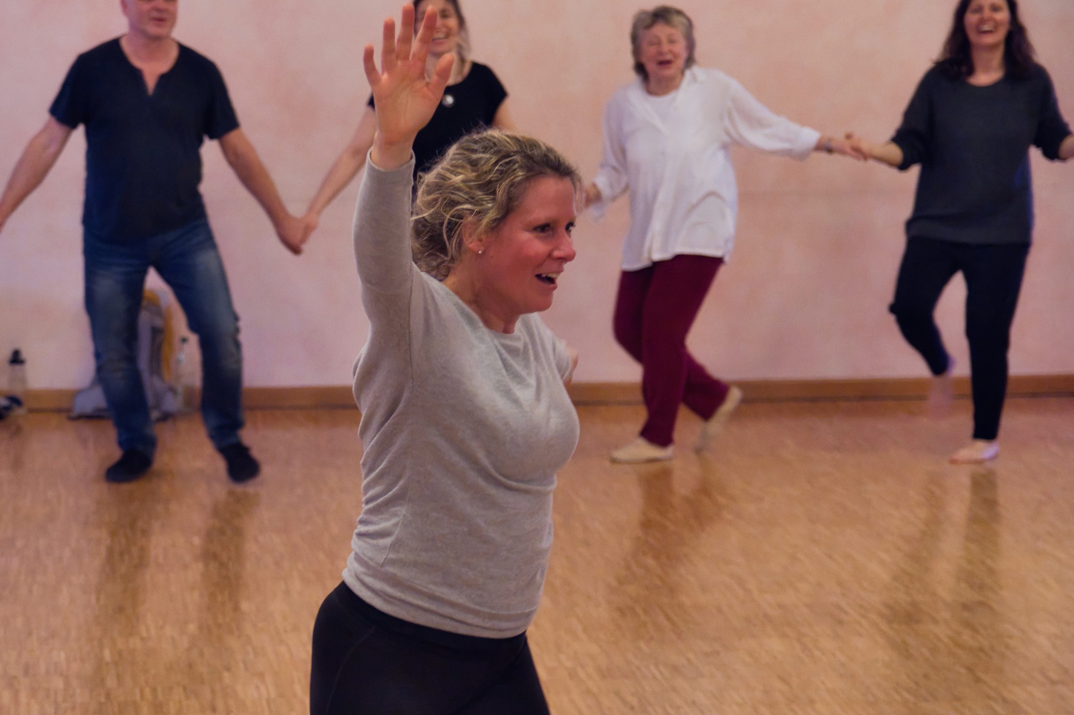 A cozy scene with warm sunlight casting stripes, featuring a potted plant and soft towels on a window sill.
