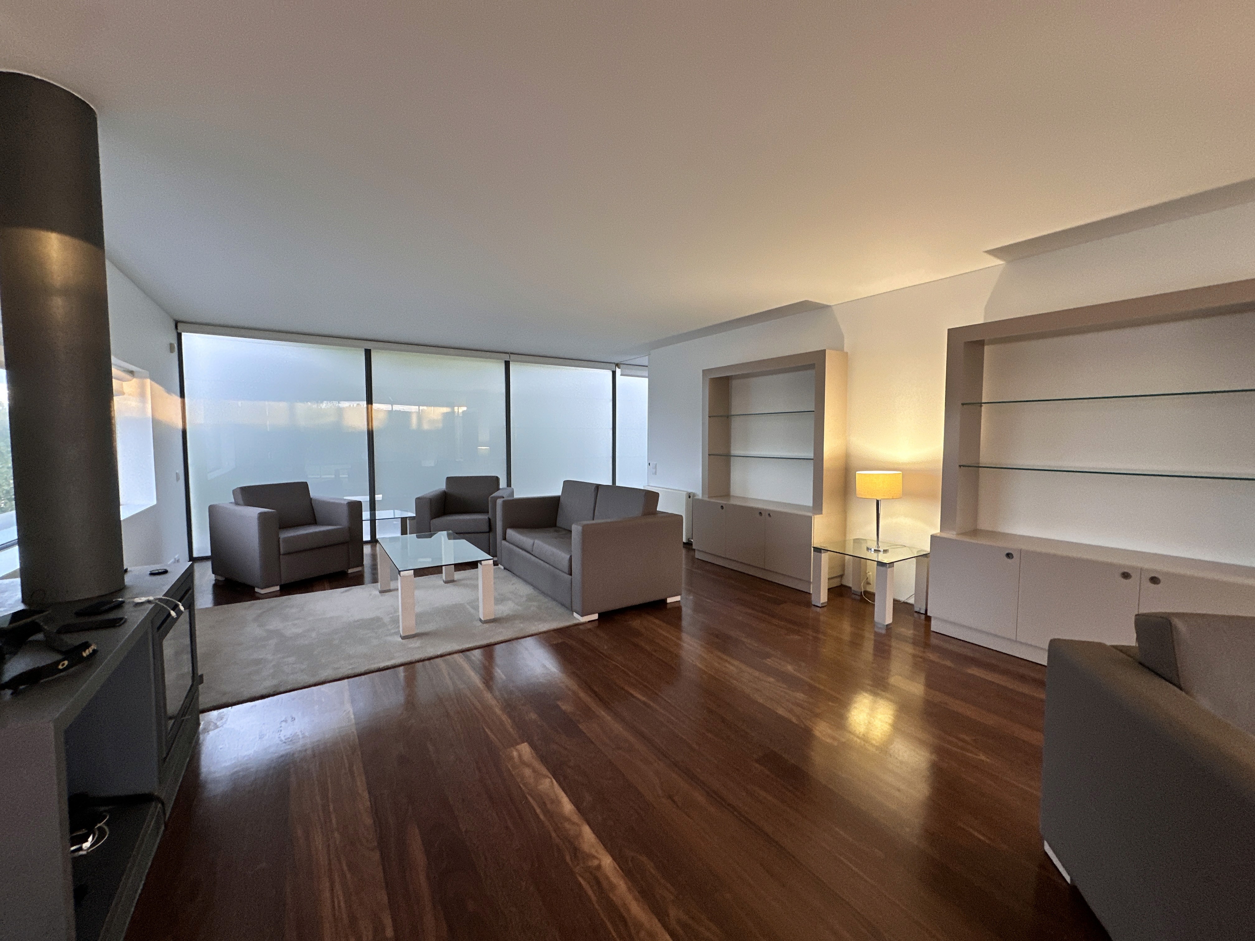 Elevated house with glass railings and scenic views
