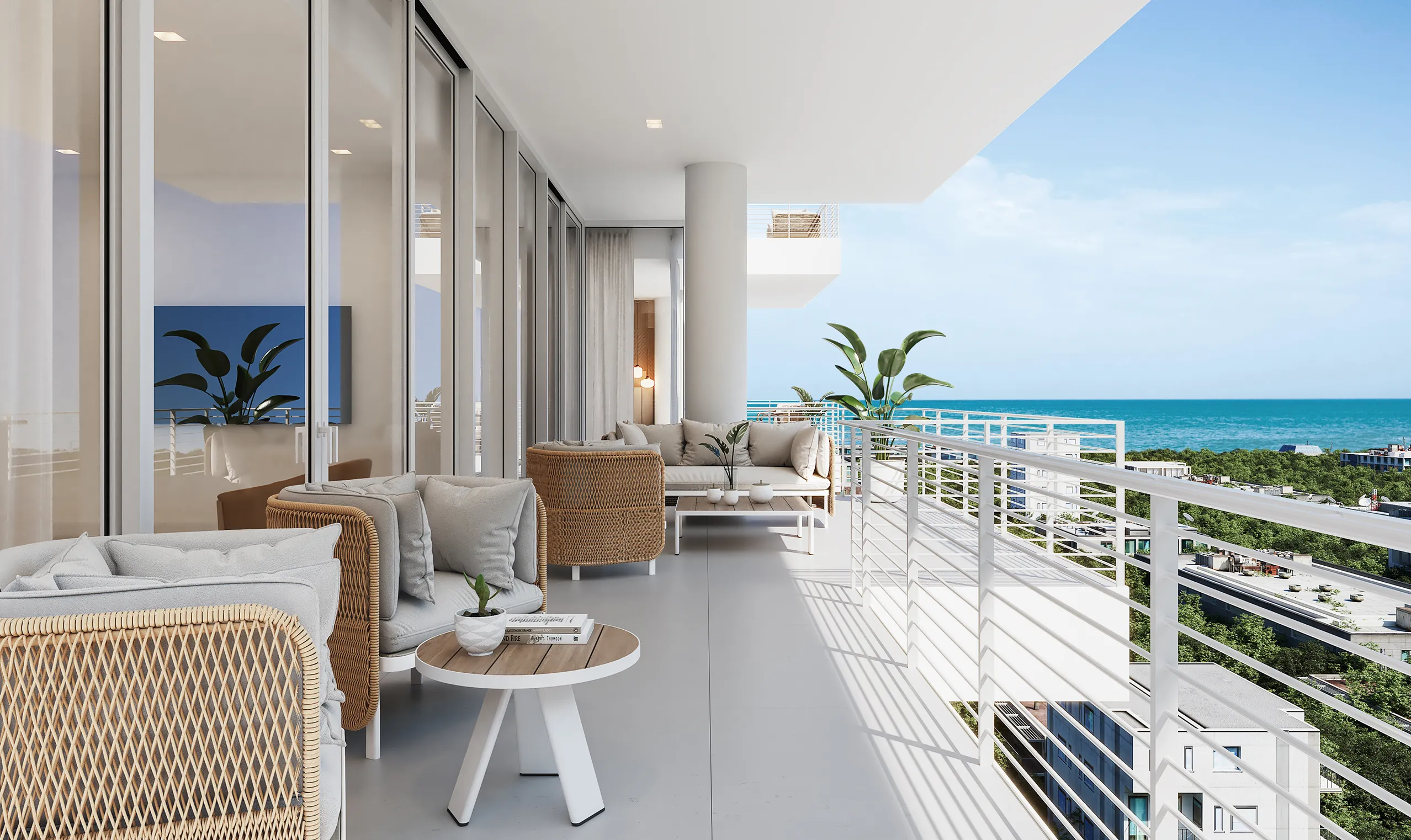 A balcony featuring wicker furniture overlooks a serene ocean view under a clear blue sky.