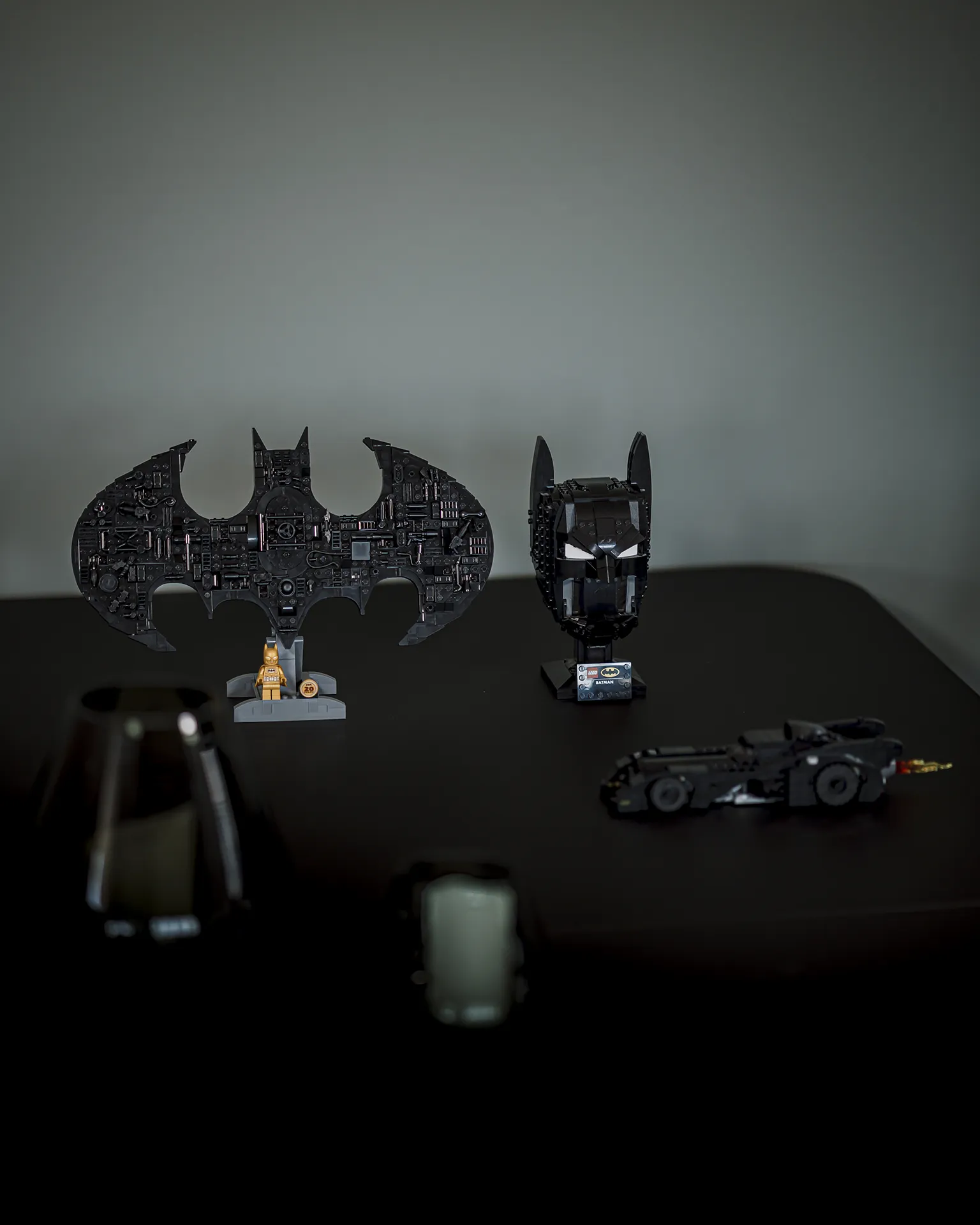 Ulike LEGO® Batman modeller av logo, byste og Batmobile