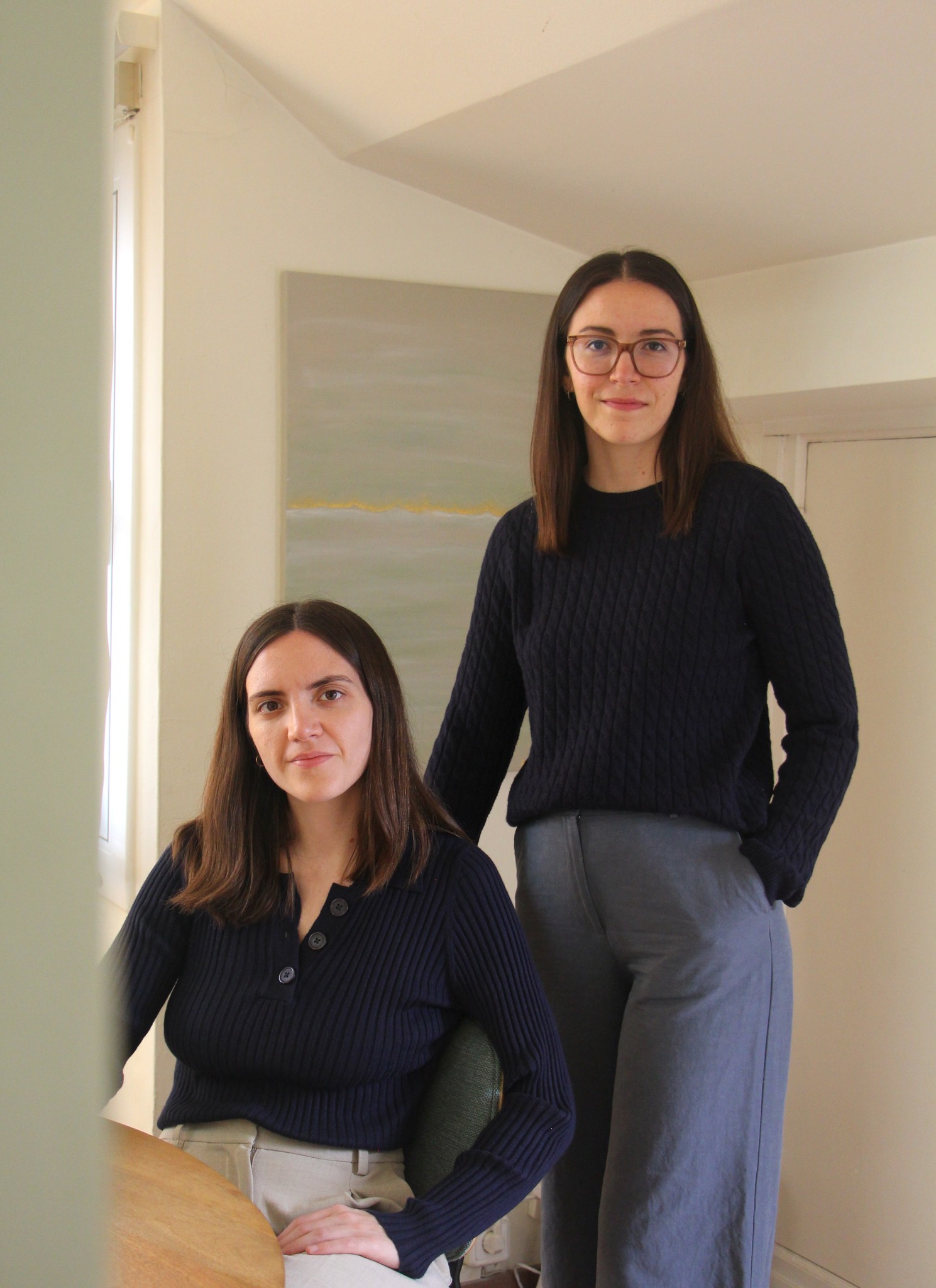 A photo of the two founders of the studio looking at the camera.