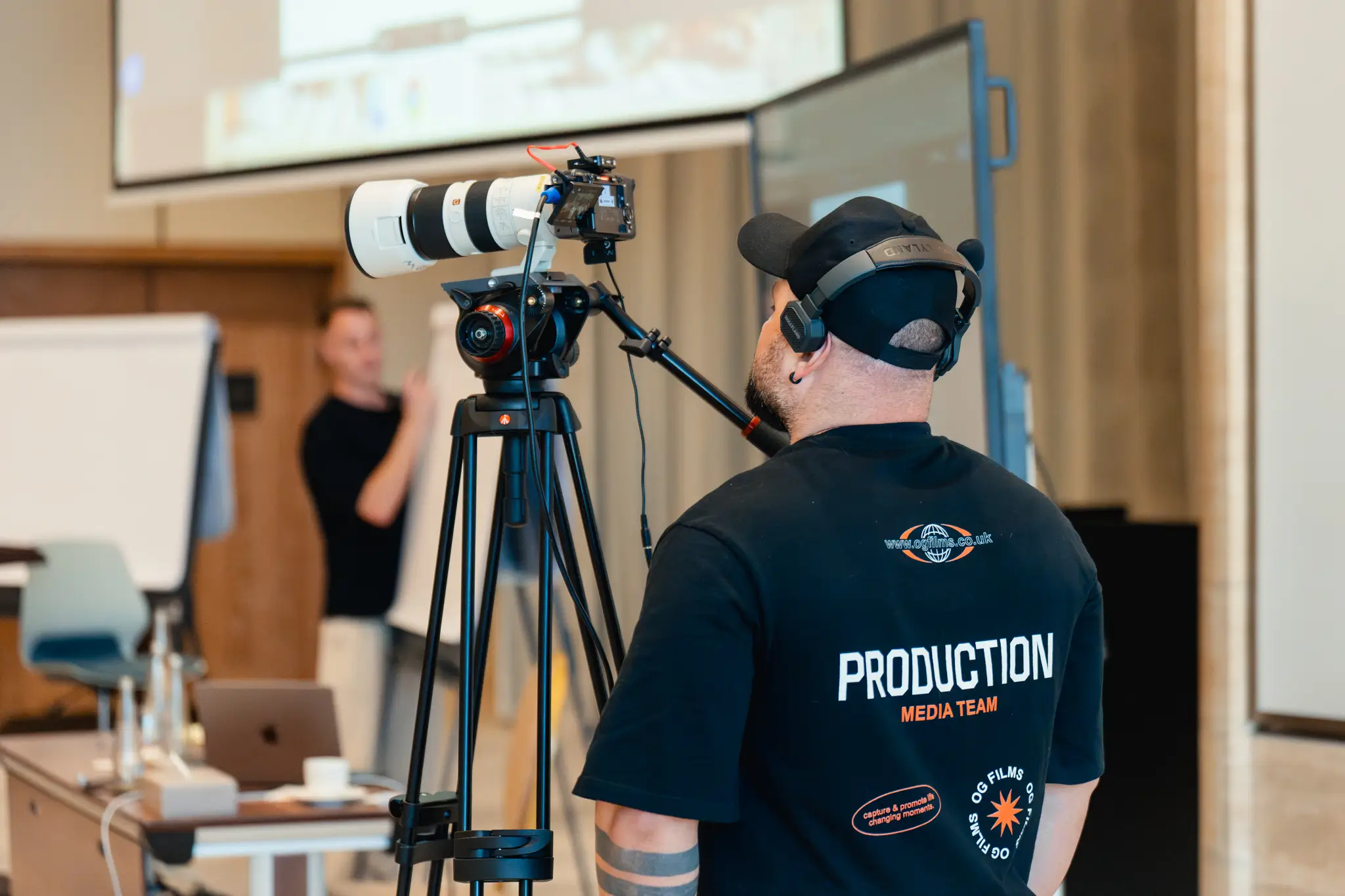 Interior of a cafe or workspace with several people at tables