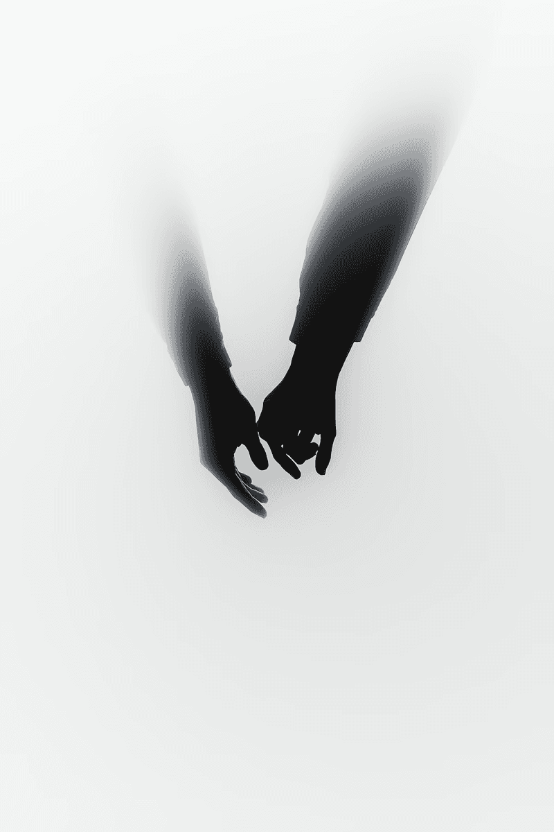 Minimalist silhouette of two hands reaching towards each other in a hazy