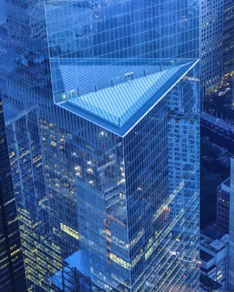 Chicago financial district buildings reflecting blue light.